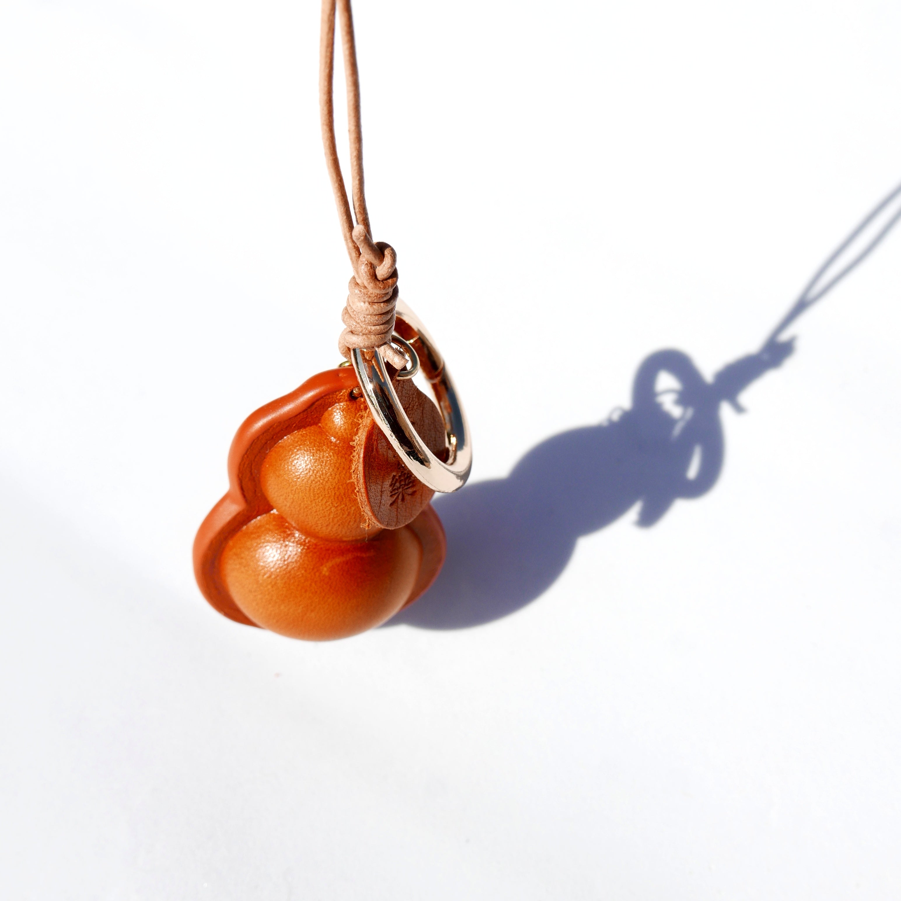 Charm de piel Hulu caramelo (calabaza china)