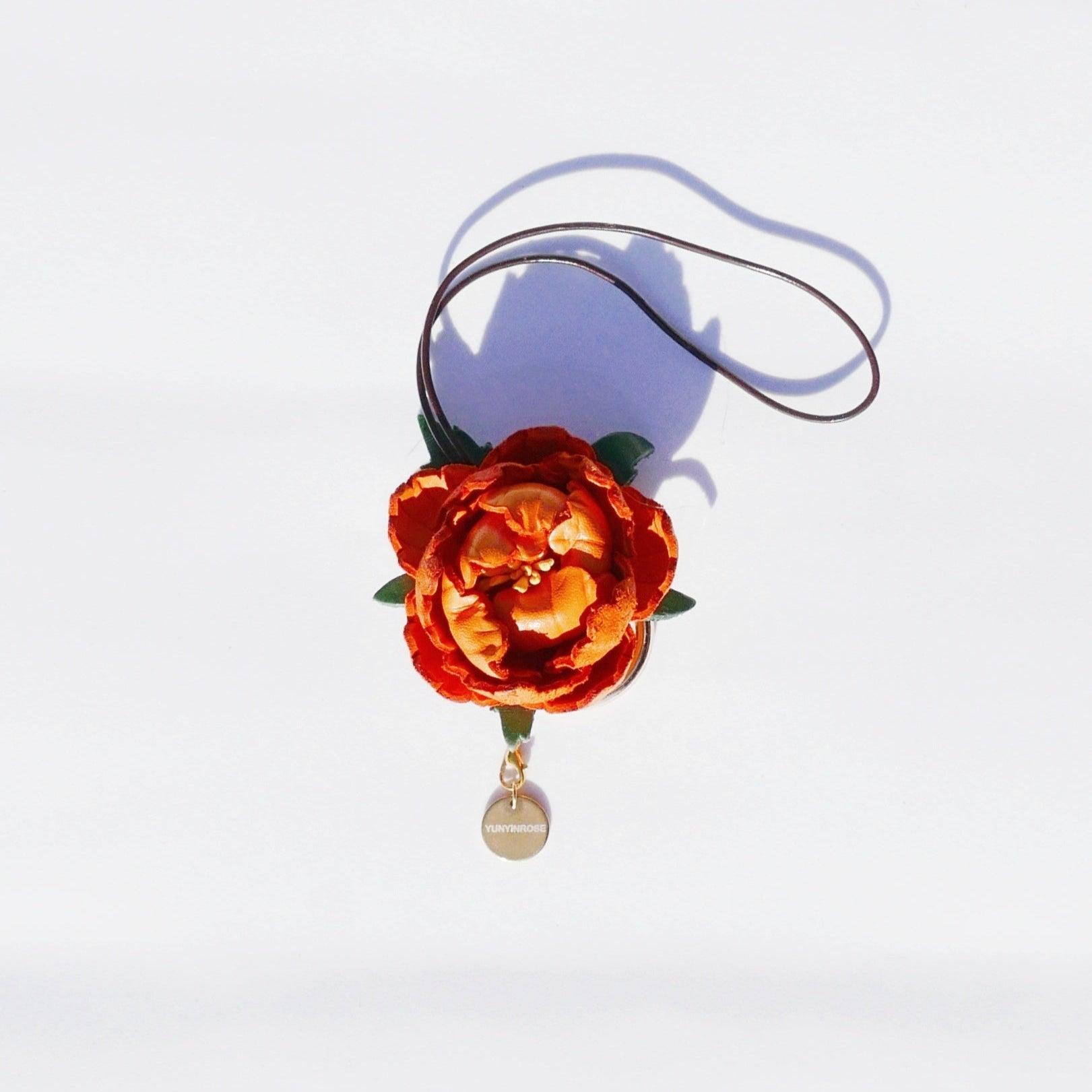 Charm de piel flore Mudan naranja