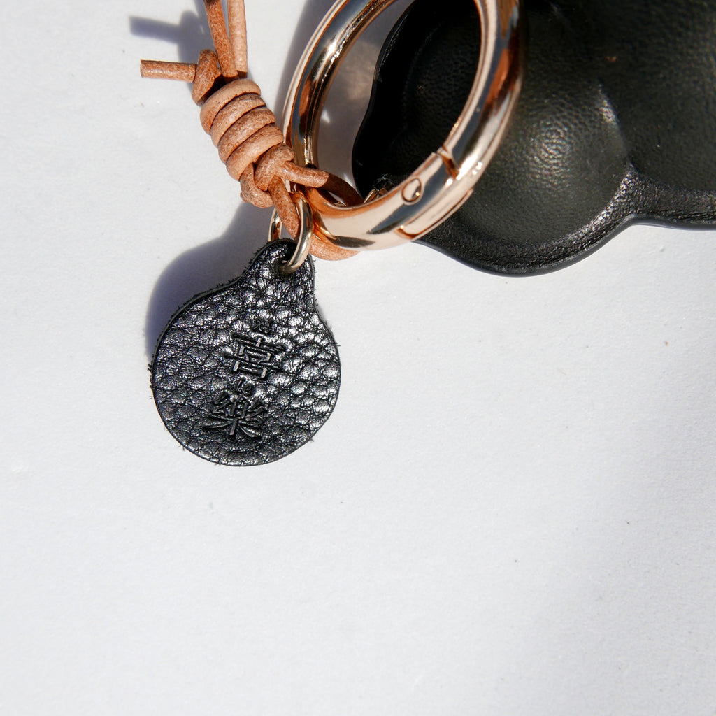 Charm de piel Hulu negro (calabaza china)