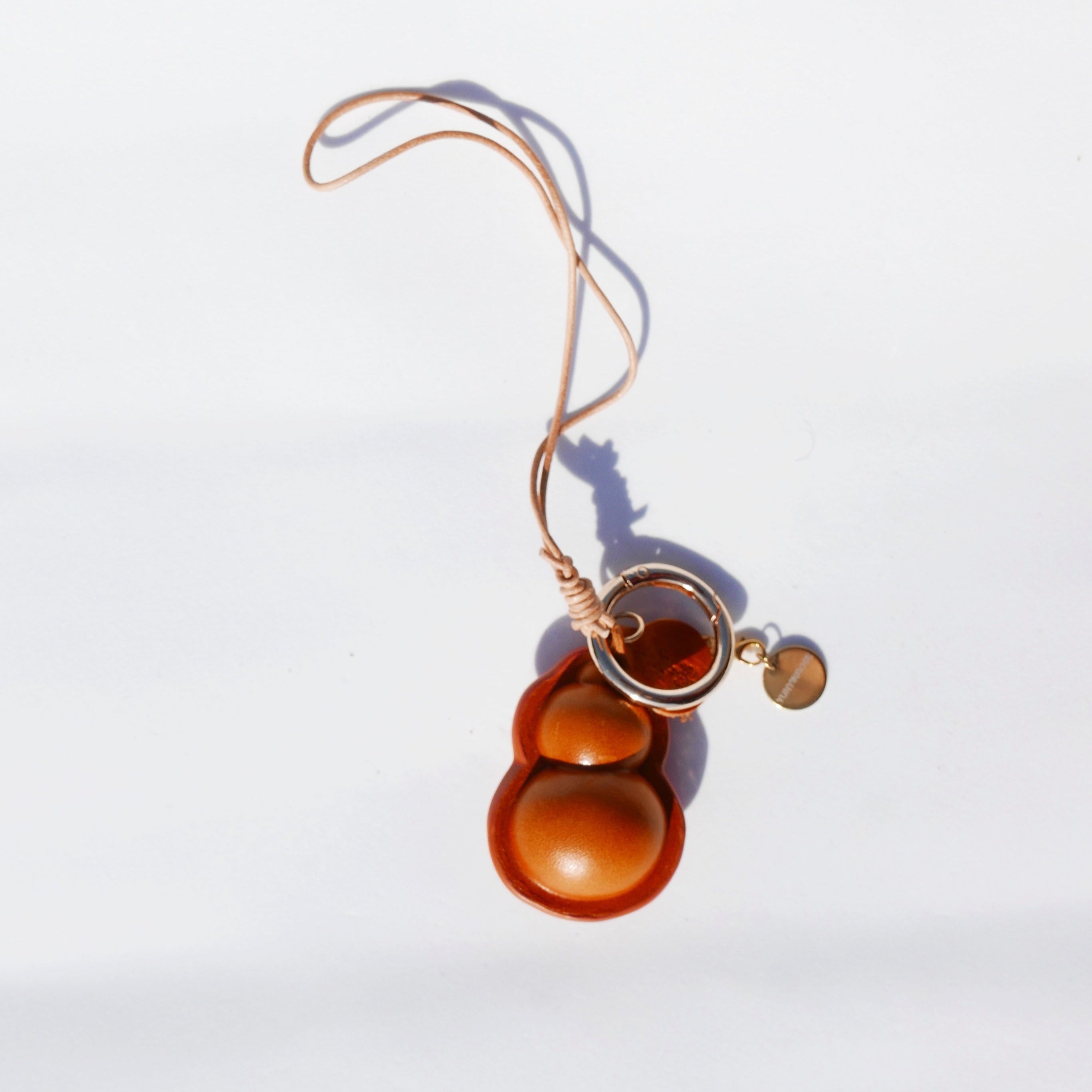 Charm de piel Hulu caramelo (calabaza china)