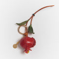 Charm de piel granada rojo