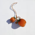 Charm de piel caqui