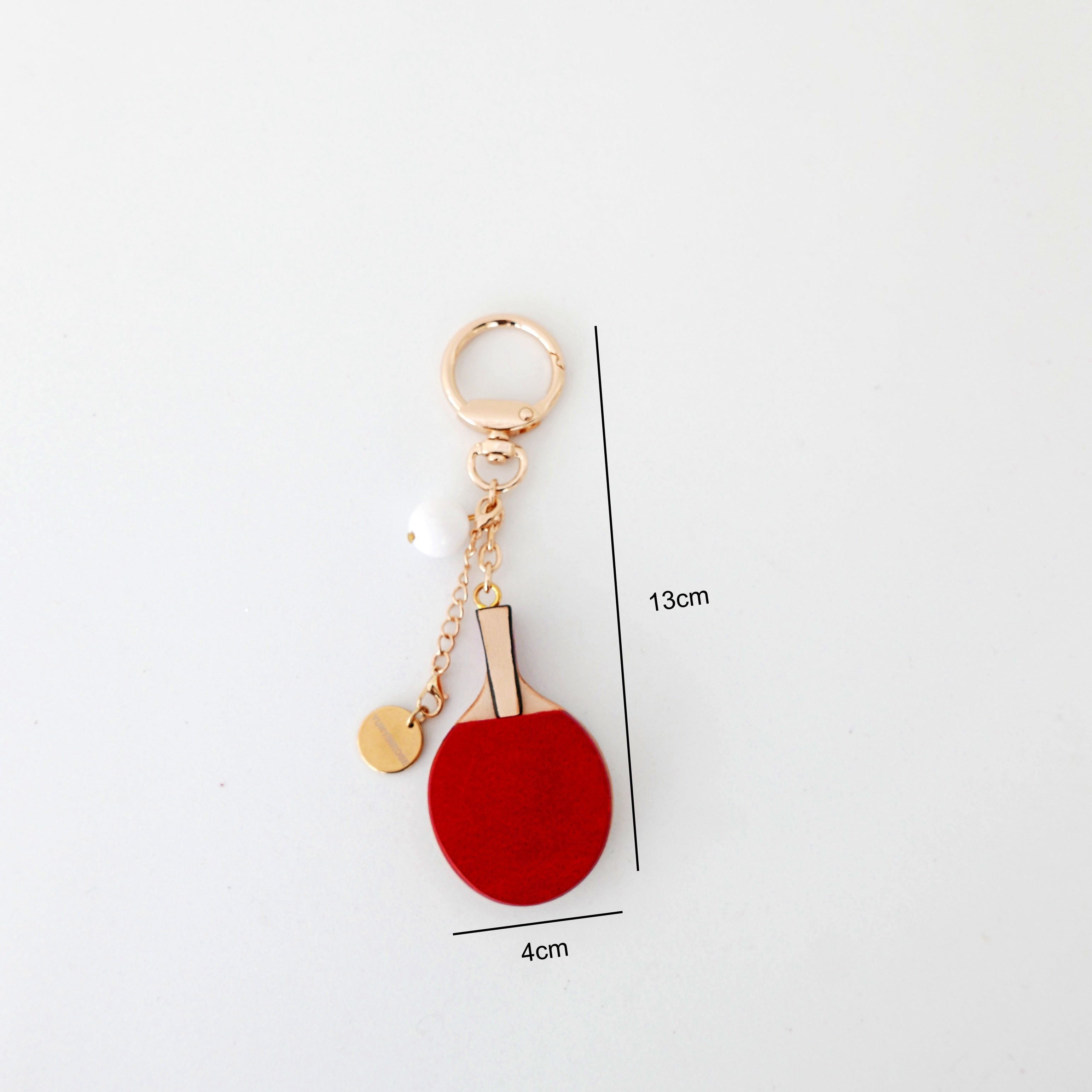Llavero de piel en forma de pingpong rojo y negro